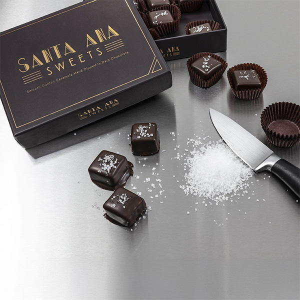 Glamour shot of Twelve piece box of Santa Ana Sweets chocolate covered salted caramels | Santa Ana Sweets
