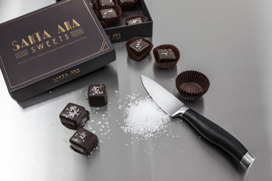 santa ana sweets chocolate covered caramels with salt and knife